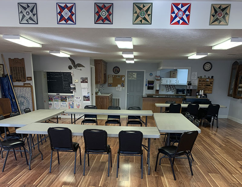 photo of the hall with tables and chairs